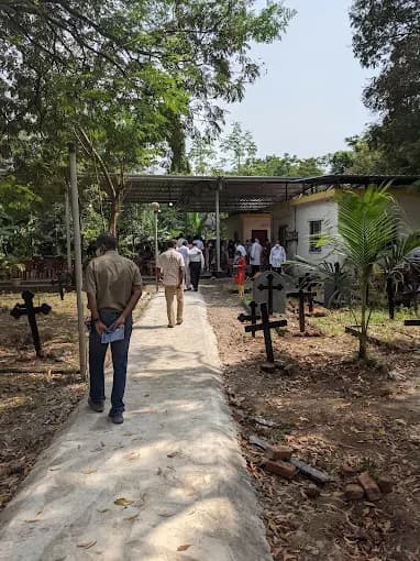 Peaceful pathways at Nerul Cemetery with lush greenery